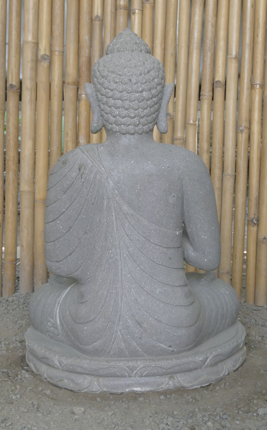  Product image 6 of the product “Seated Buddha made of Riverstone in Dharmachakra gesture of wheel of the teaching of the Dharma, H. 83cm. There is a stone eye on the left shoulder. ”